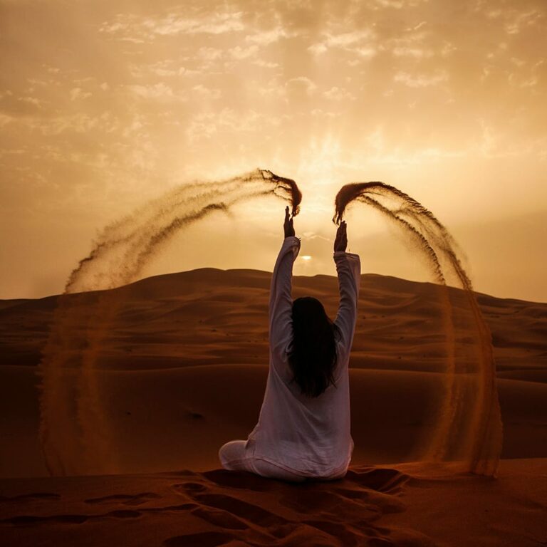Woman throwing sand